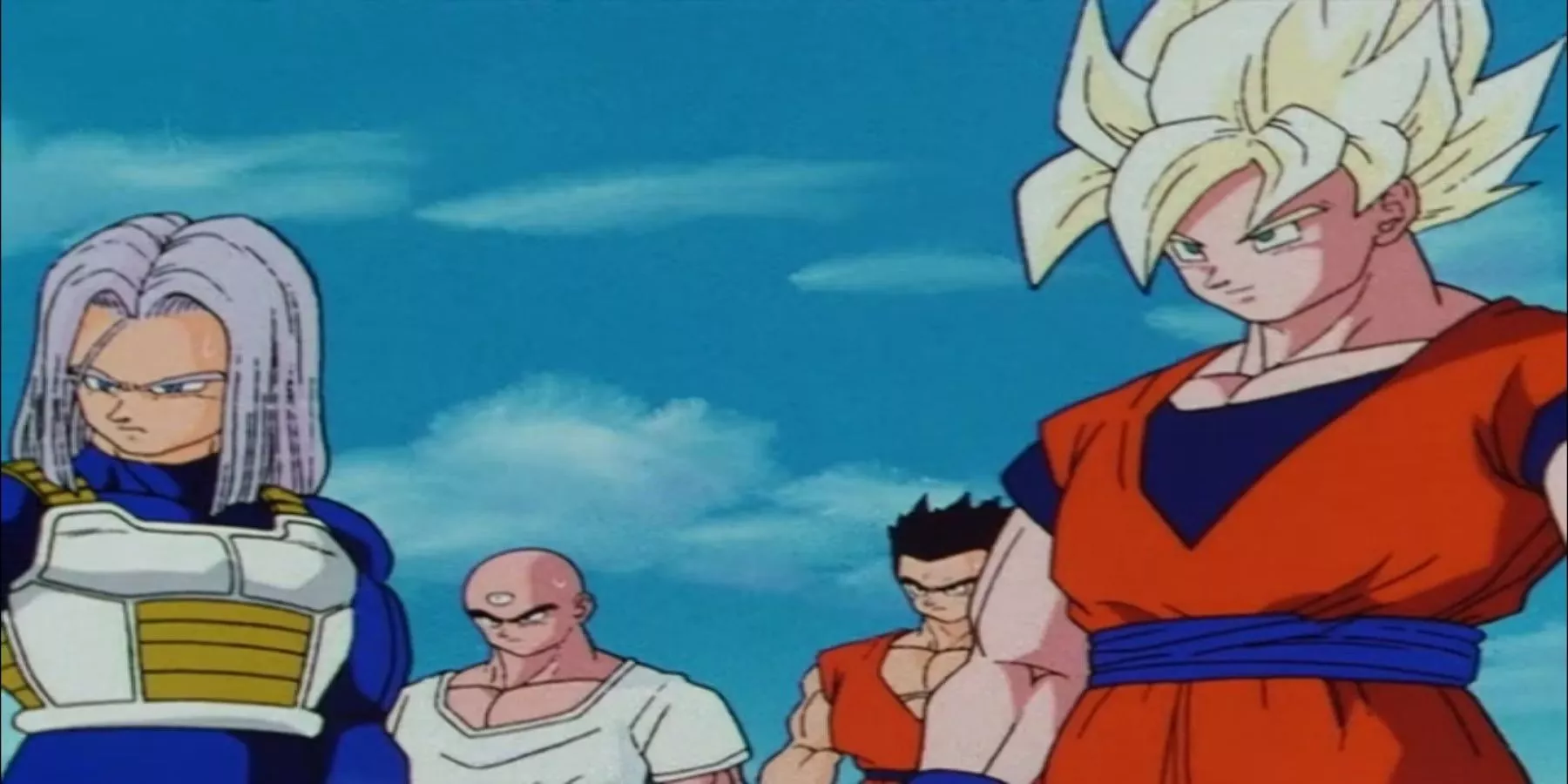 Goku is in super saiyan form while standing with trunks and their friends.