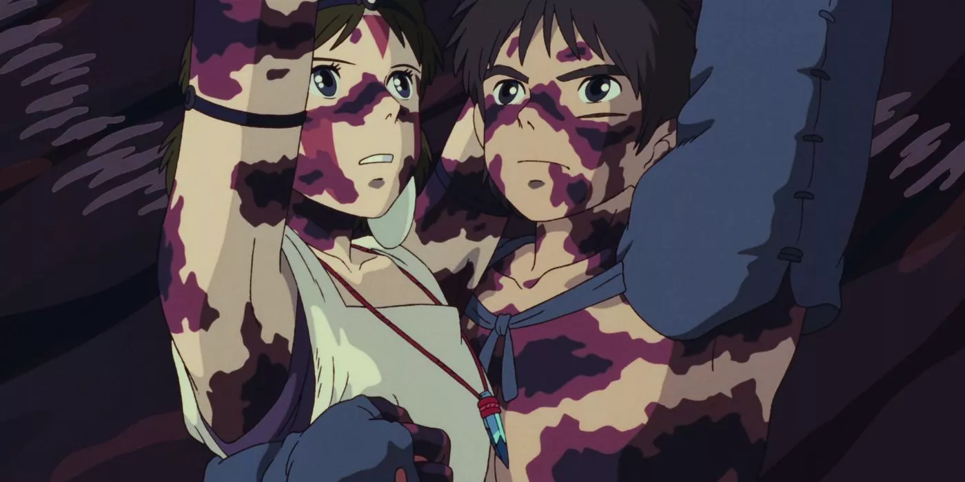 San and Ashitaka covered in curse marks, hold up the Forest Spirit's head in Princess Mononoke.