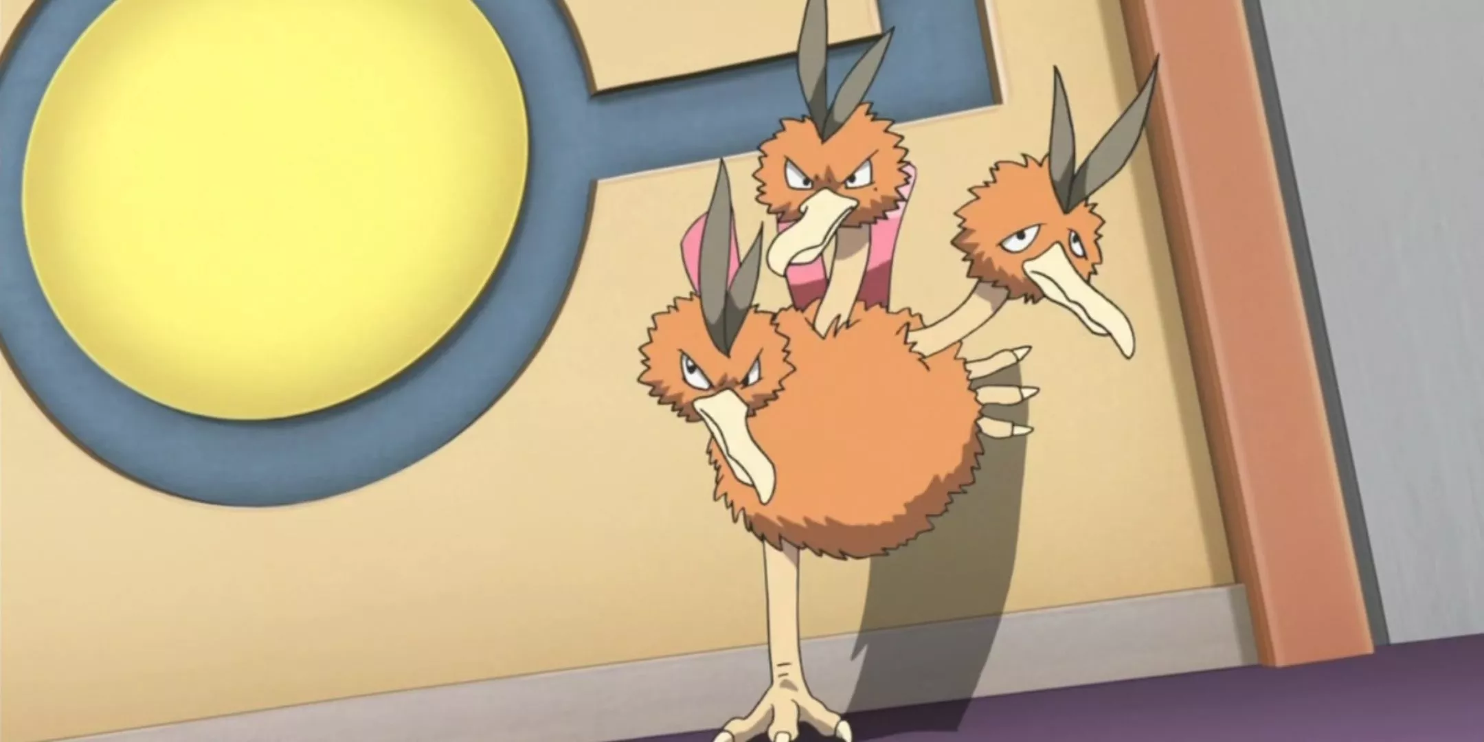 Dodrio bracing one foot behind it against the wall while looking straight ahead with a determined look on two of its heads from Pokemon