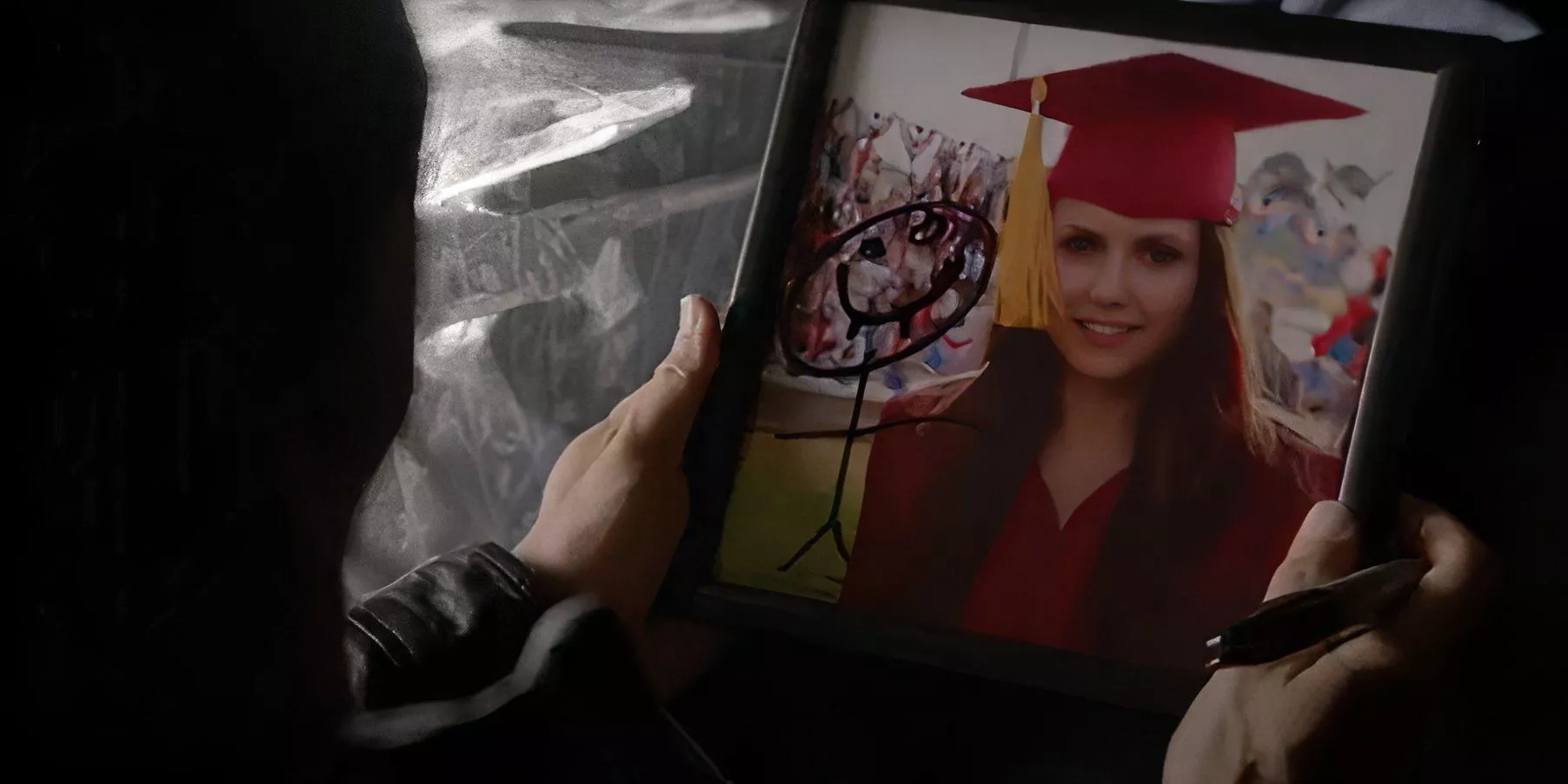 Elena's photo with a stick figure in The Vampire diaries