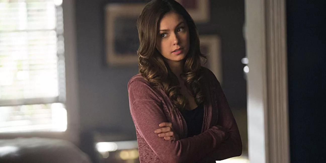 Elena Gilbert (Nina Dobrev) has her arms crossed in Season 6 of The Vampire Diaries 