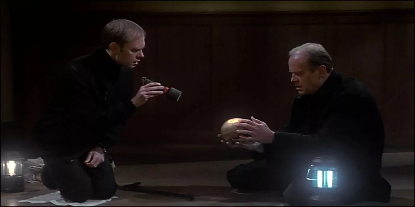 Niles and Fraiser inspecting a skull