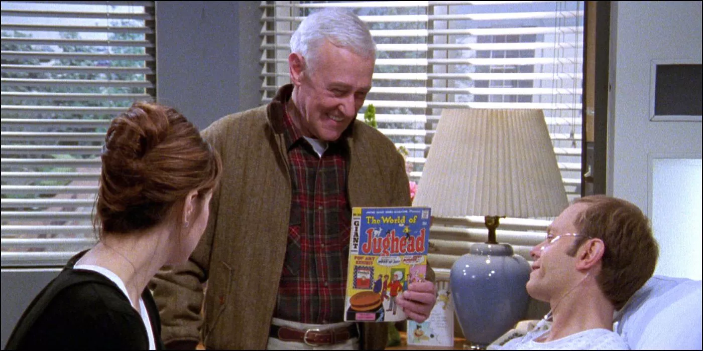 Daphne and Martin show Niles a comic book in hospital