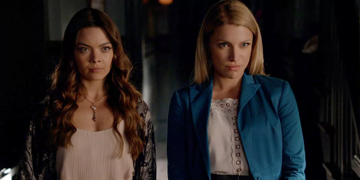 Nora and Mary Louise look cunningly at someone else in The Vampire Diaries