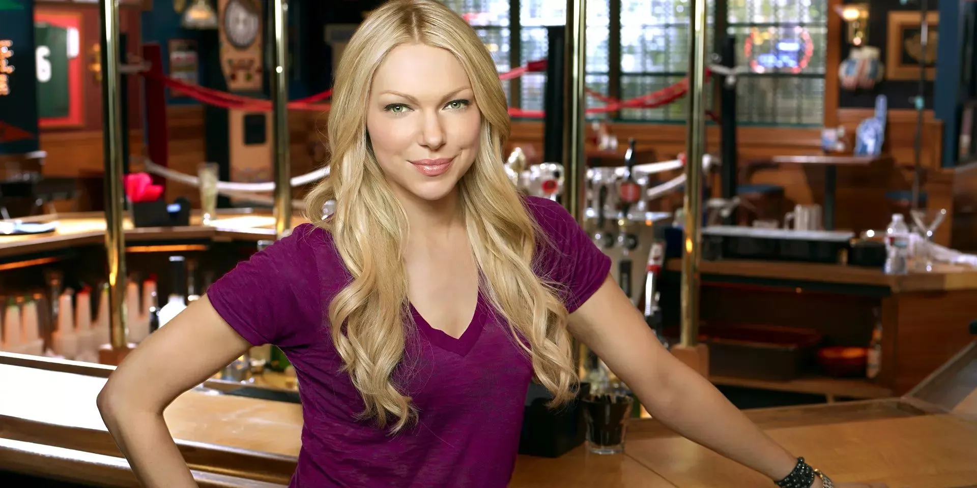 Laura Prepon standing at the bar in Are You There, Chelsea?