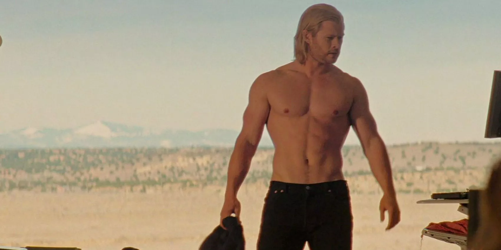 Thor (played by Chris hemsworth) with his shirt off while at the desert in the MCU