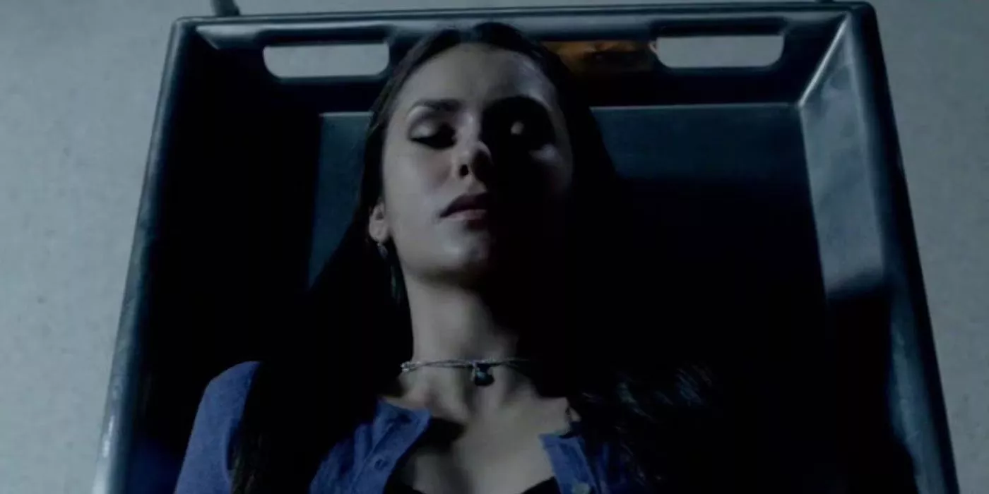 Elena lies on the table as she transforms into a vampire in The Vampire Diaries