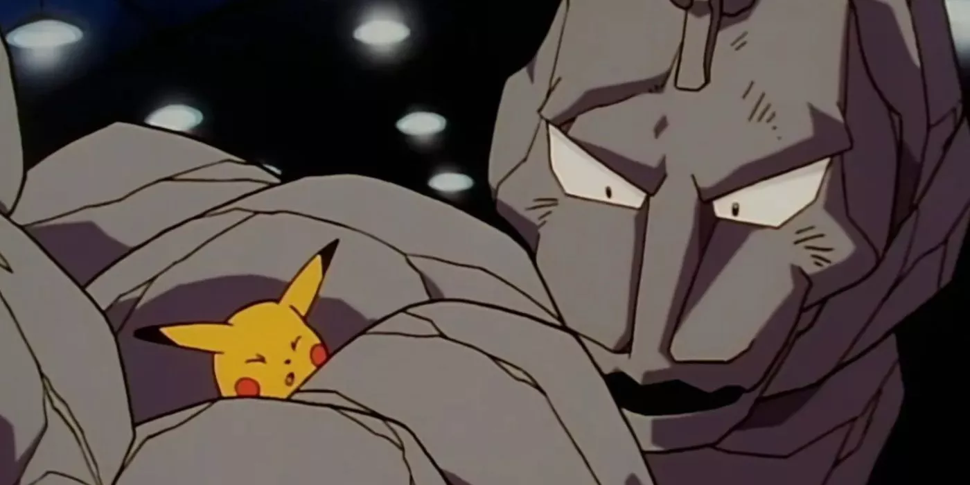 Onix de Brock enrollado alrededor de un Pikachu indefenso en el anime de Pokémon.