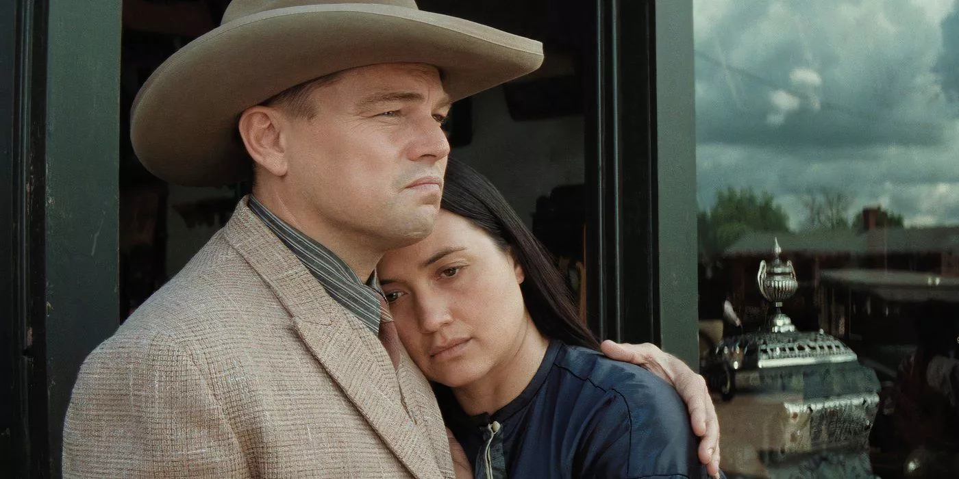 Leonardo Dicaprio as Ernest and Lily Gladstone as Molly embracing each other after another family tragedy in Killers of the Flower Moon.