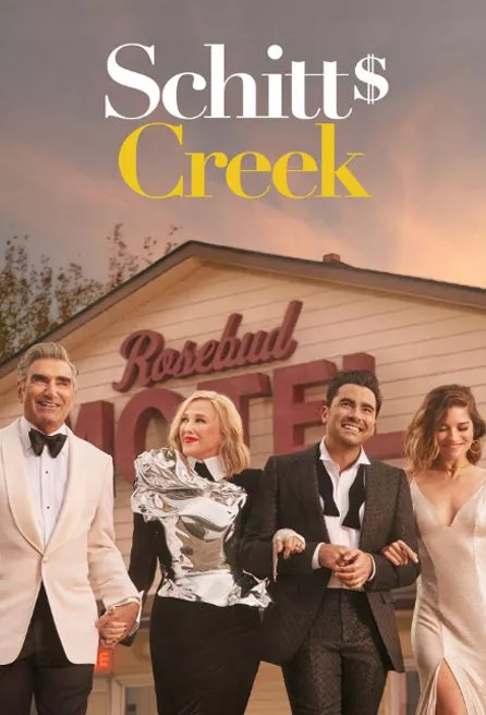 Schitts Creek Cast In front of the Rosebud Motel in series poster.