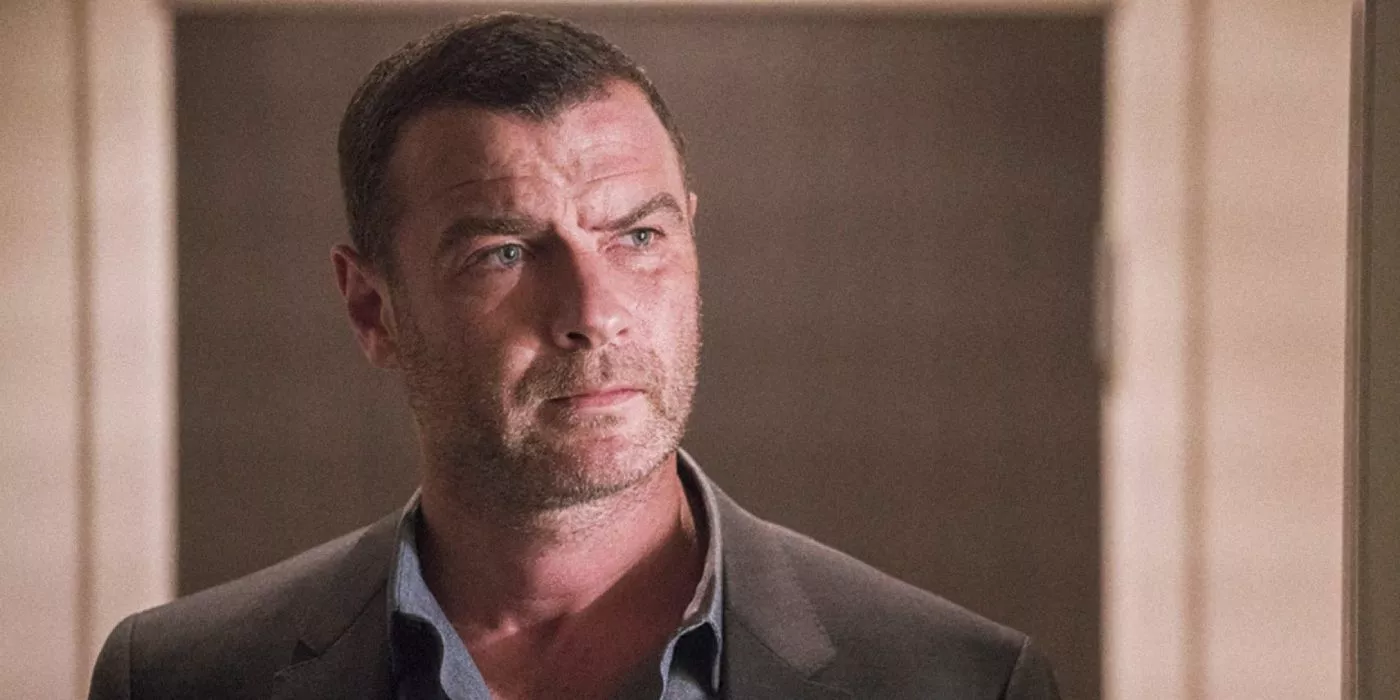 Ray Donovan looks quizzically while wearing a sports coat