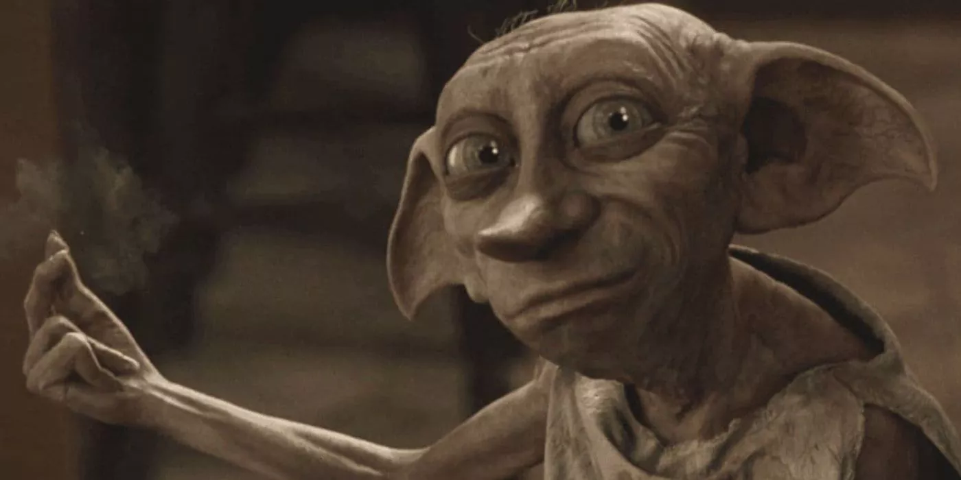 Dobby doing magic while looking over at something in the Harry Potter movies