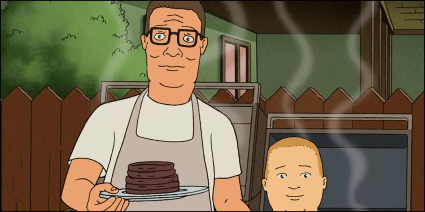 Hank and Bobby standing next to a barbecue