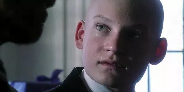 Screenshot shows a younger Lex Luther at school in a memory in Smallville.