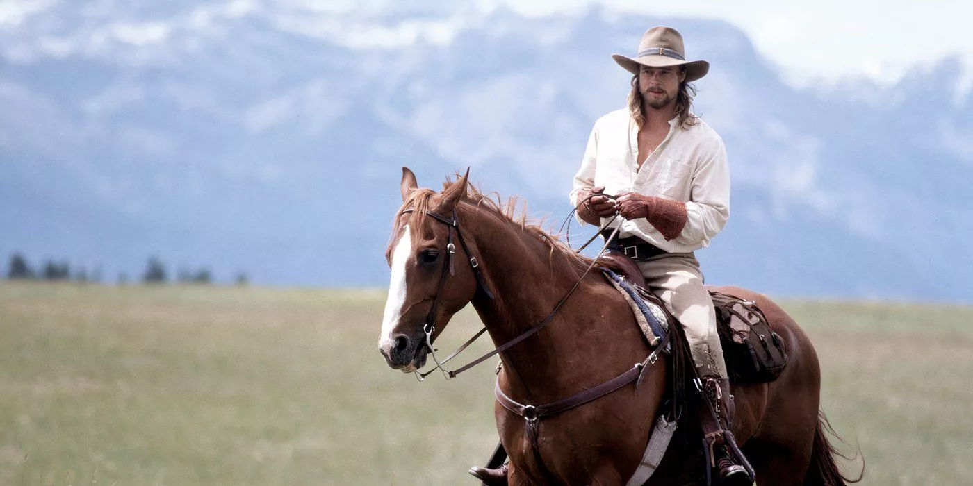 Brad Pitt as Tristan Ludlow riding his horse on his family's land in Legends of the Fall.