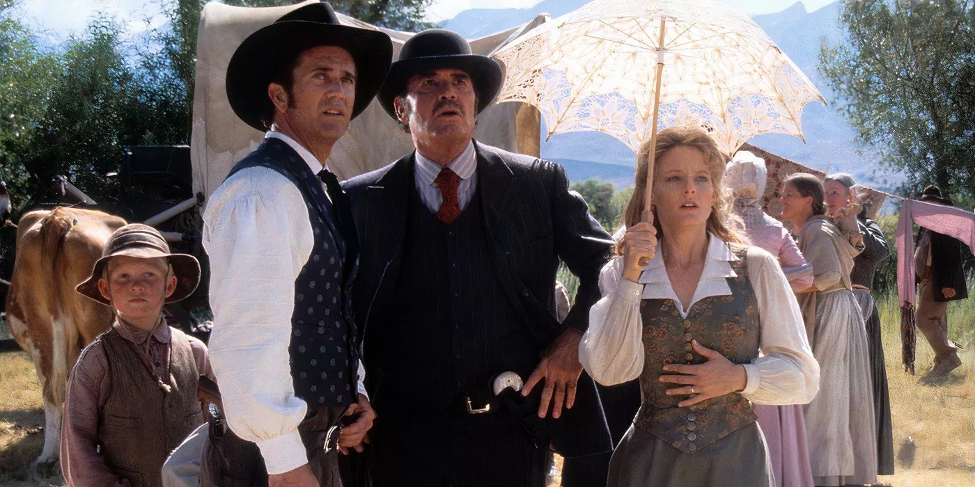 Mel Gibson, Jodie Foster and James Garner in Maverick watching something approach them.