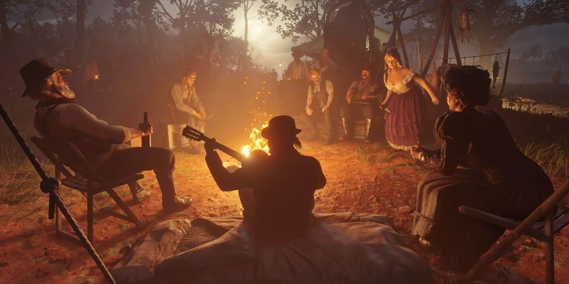 The gang sitting around a campfire in Red Dead Redemption 2