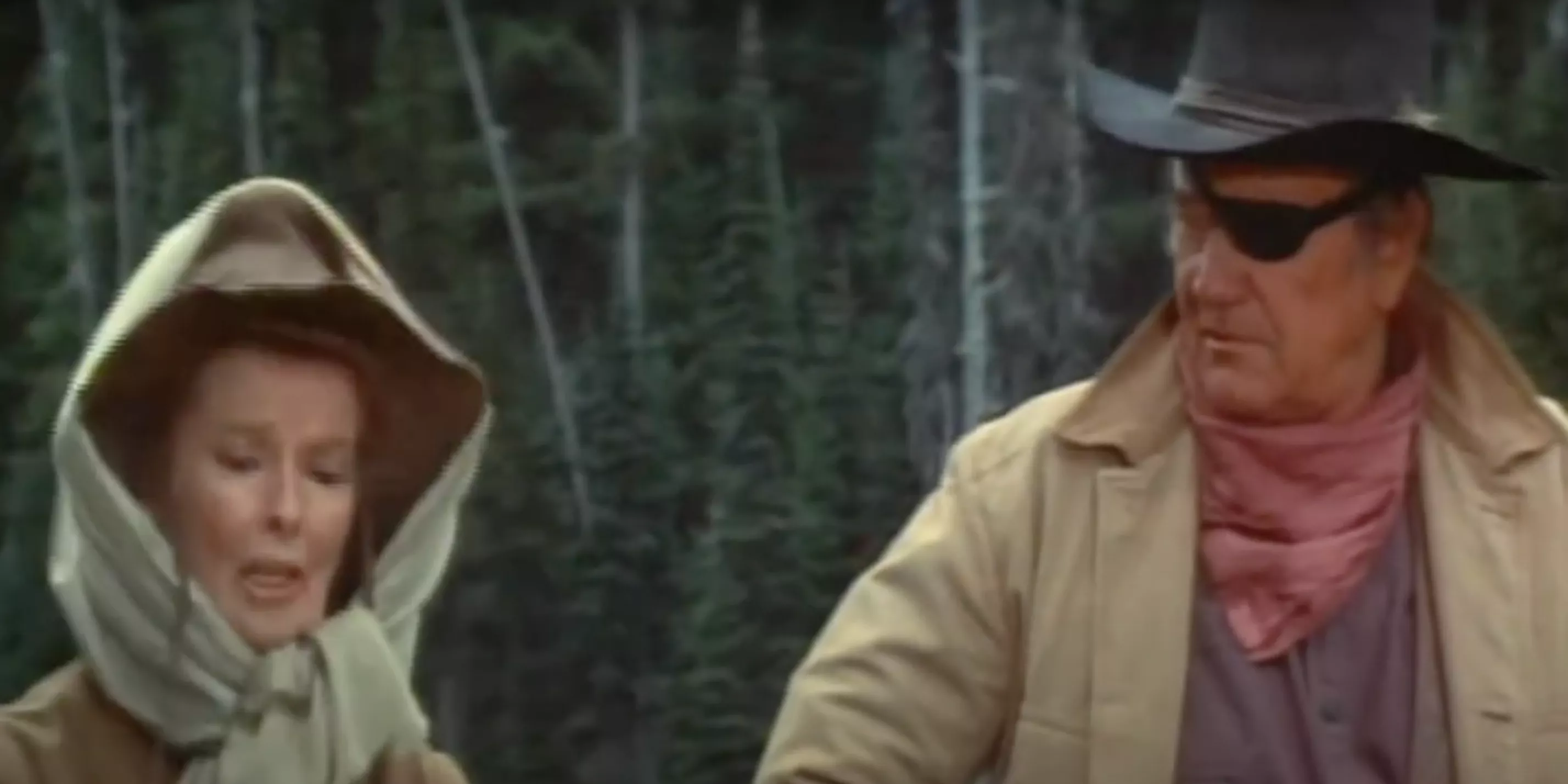 Eula (Katherine Hepburn) and Rooster Cogburn (John Wayne) bicker in Rooster Cogburn