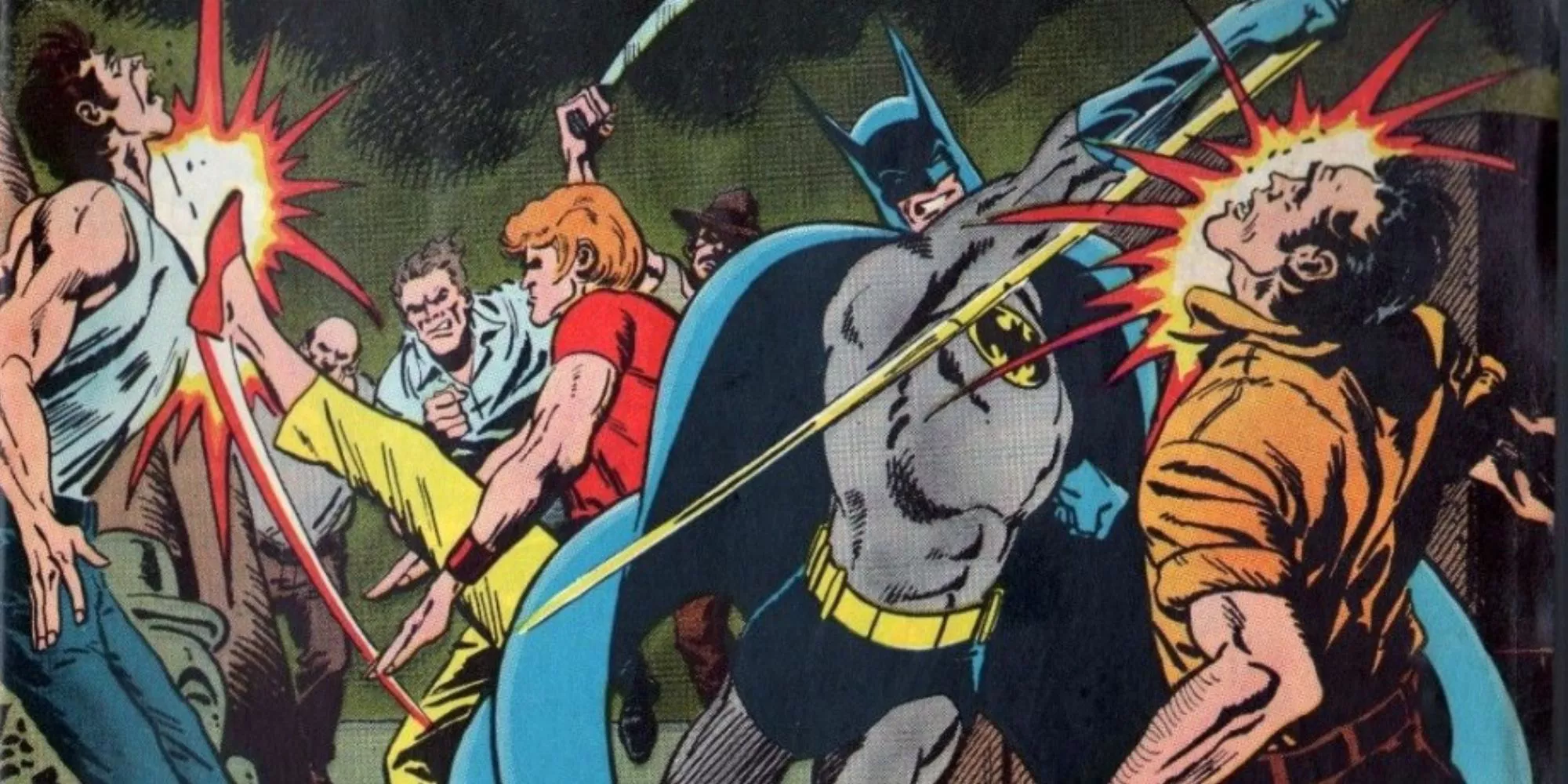 Batman and Richard Dragon fight some criminals.