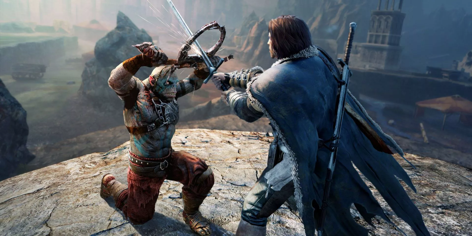 An orc is brought to its knees block an attack from Talion in Middle-Earth Shadow of Mordor