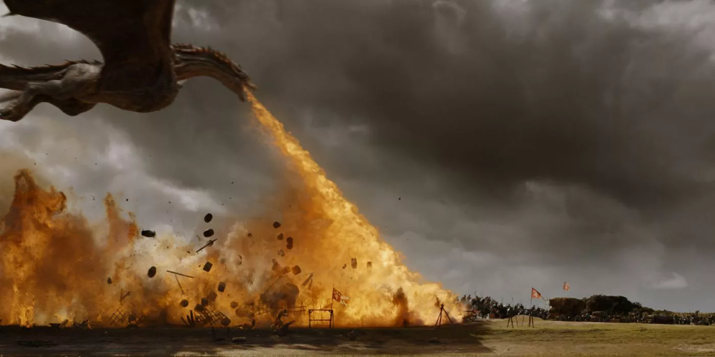 A dragon spews fire on an army supply in Game of Thrones