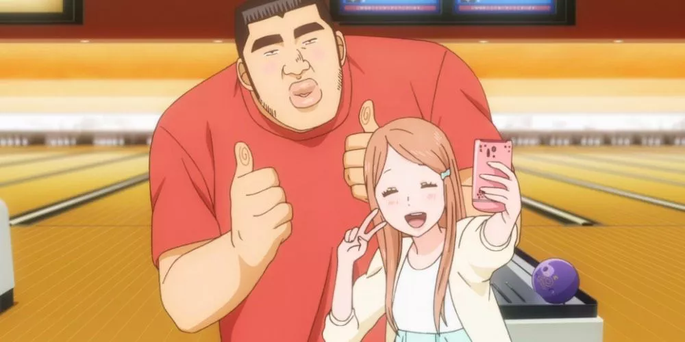 Takeo Gouda and Rinko Yamato taking a selfie at a bowling alley in My Love Story!!.