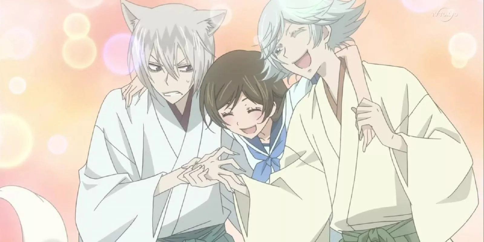 Tomoe and Mizuki hold up Nanami in Kamisama Kiss.