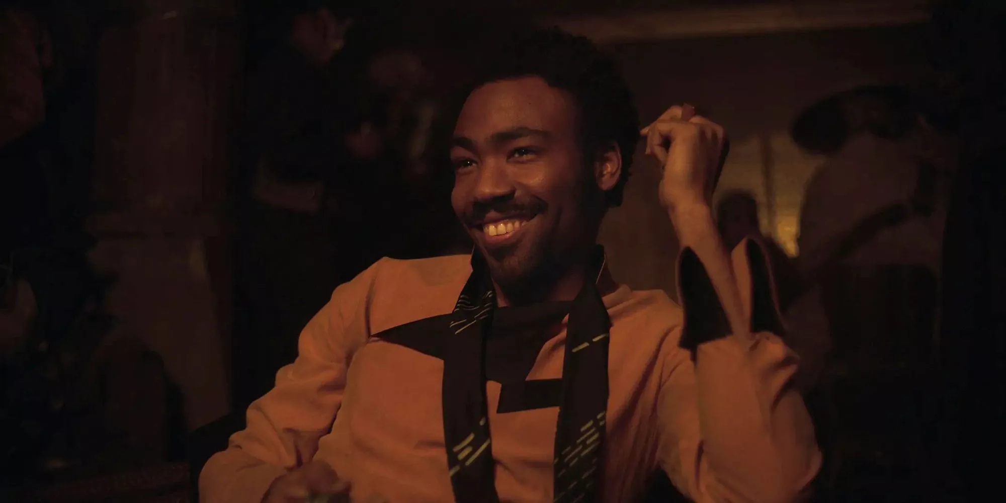 Lando Calrissian, played by Donald Glover, smiles in Solo: A Star Wars Story