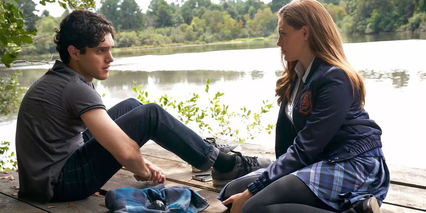 Hope and Landon sitting by a lake