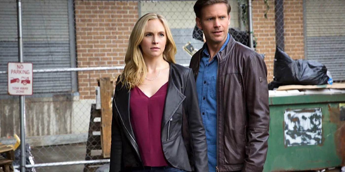 Alaric and Caroline standing in an alley in The Vampire Diaries