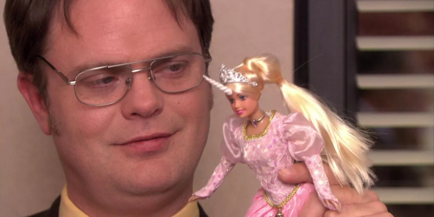 Dwight holding a doll in The Office