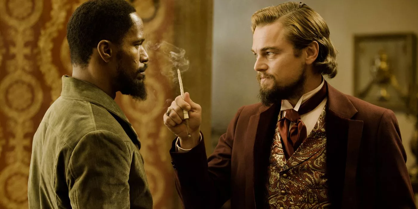 Calvin Candie smokes in front of Django in Django Unchained